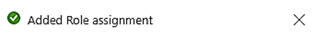 Screenshot that shows the added role assignment confirmation pop-up message.