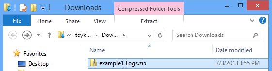 Screenshot of the Downloads folder in File Explorer with a downloaded file selected.